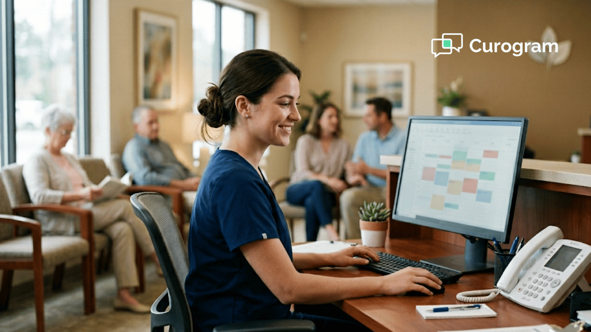 Receptionist at a small medical practice front desk with an idle phone and a calm appointment schedule on screen