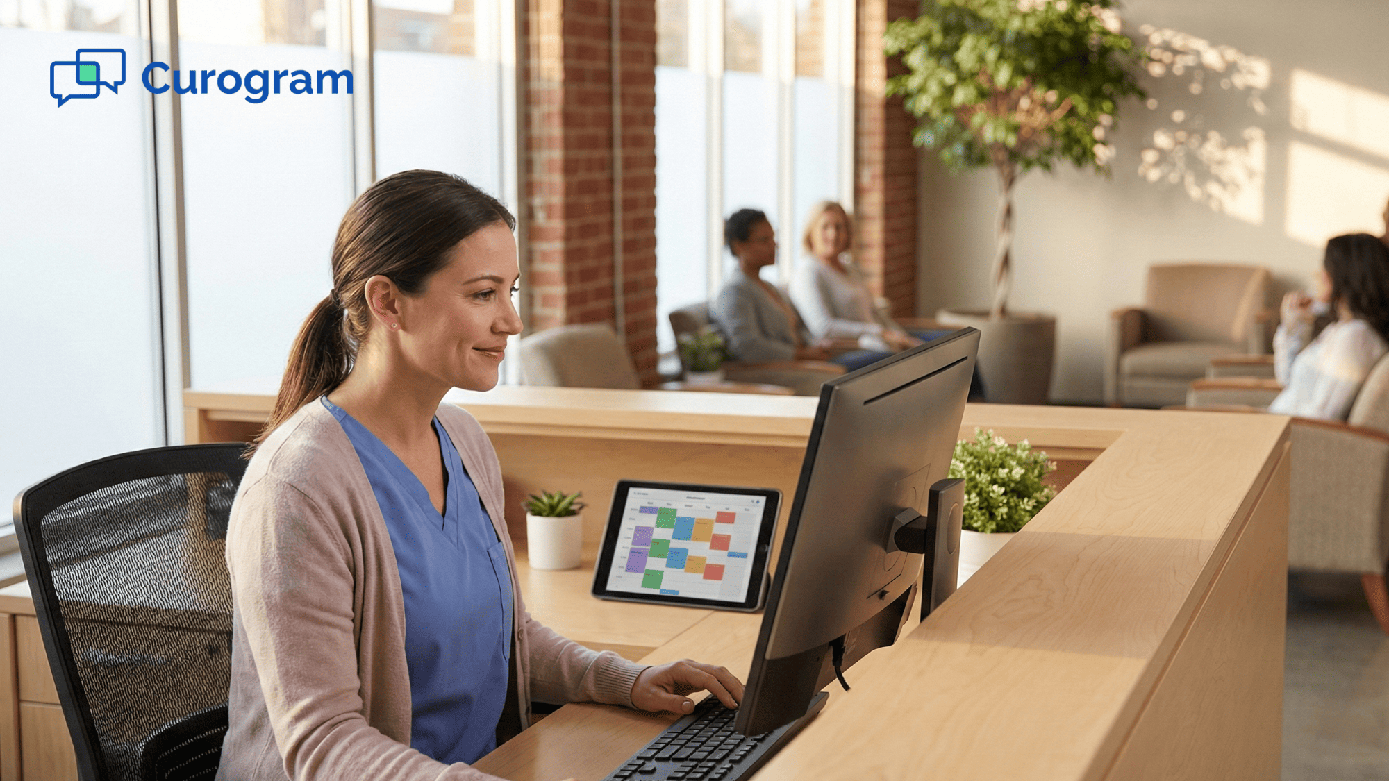 Medical practice front desk staff managing patient schedule on computer in modern clinic