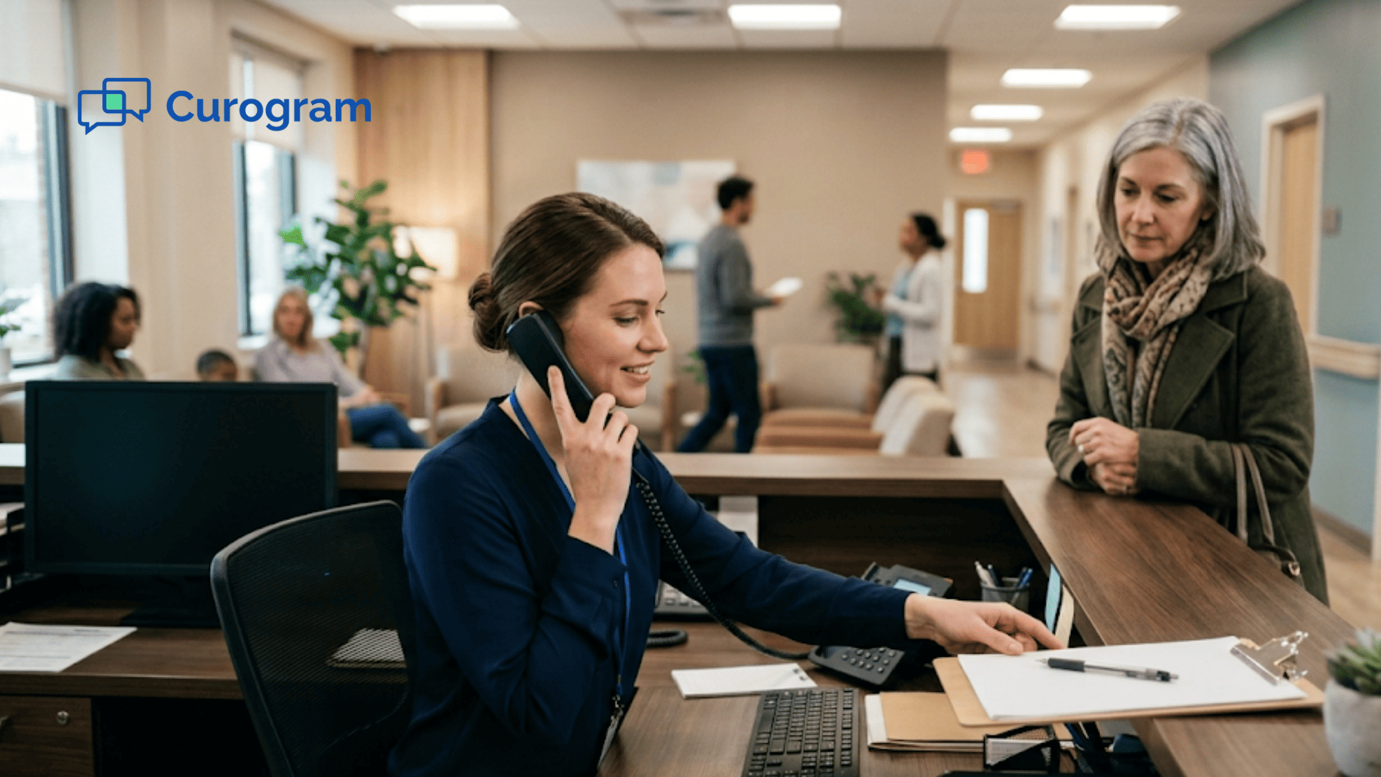 Clinic receptionist on the phone while a patient waits