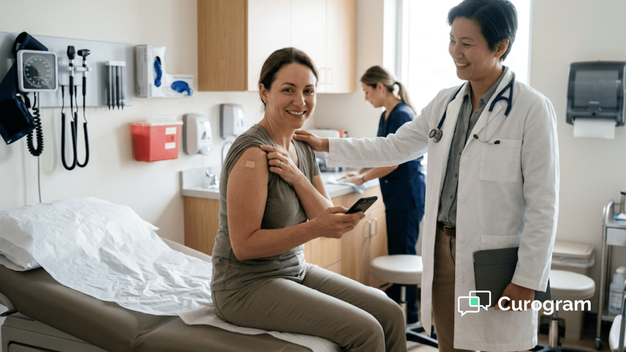 Smiling patient with a bandage on her arm checks her phone in an exam room as her doctor says goodbye after the visit