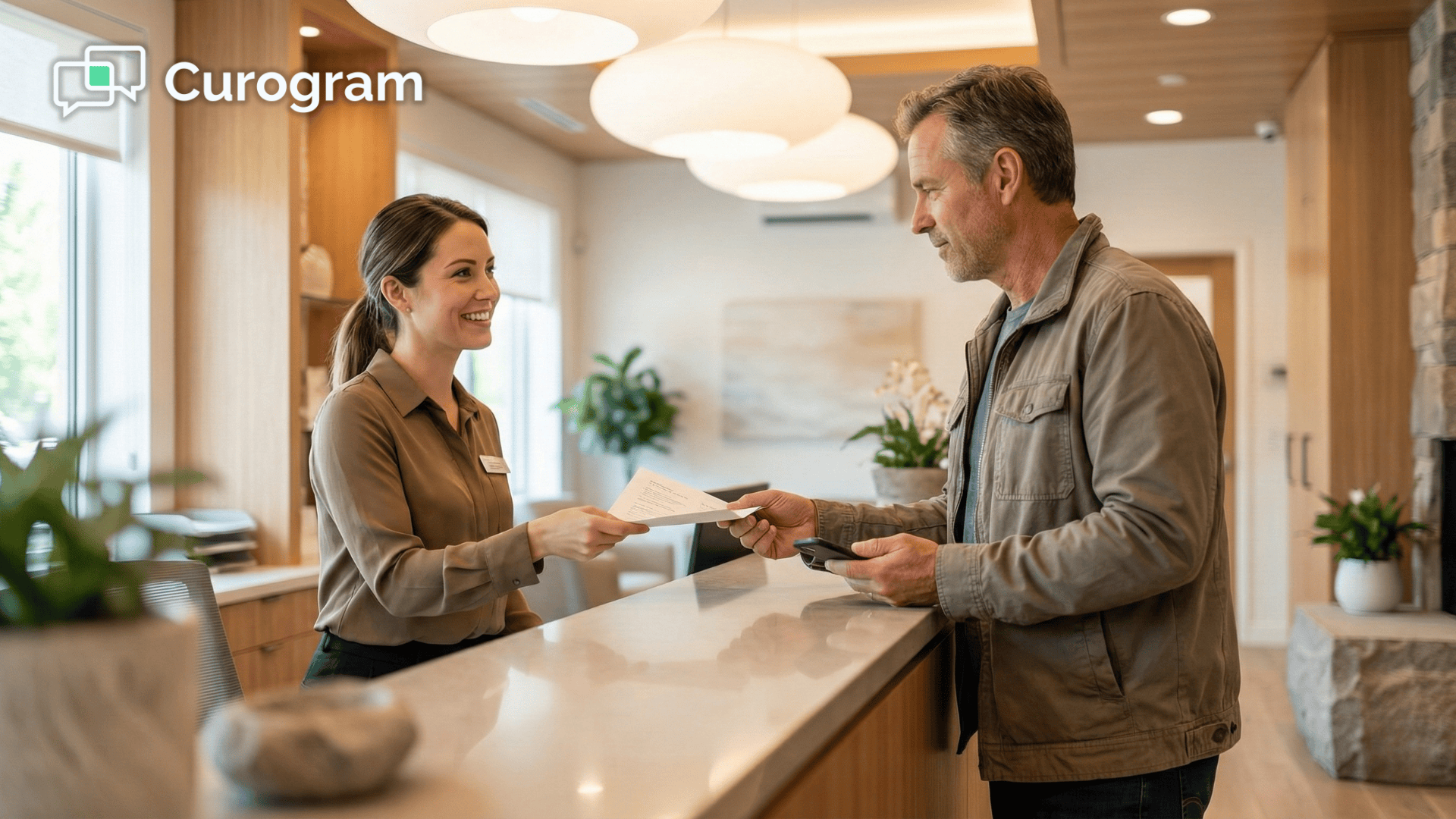 Front desk staff greeting a patient during checkout at an integrative clinic