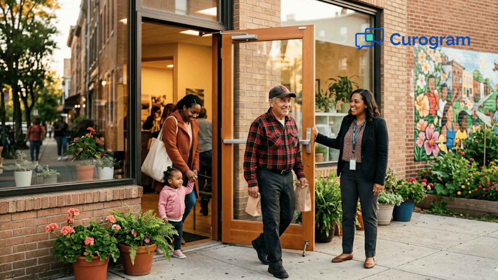 Community behavioral health clinic entrance with staff welcoming clients during golden hour