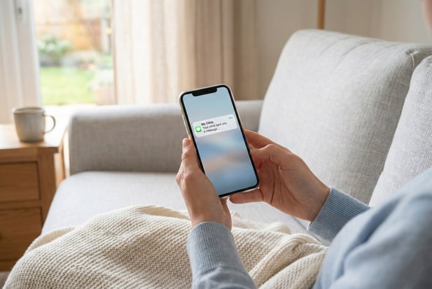 Patient at home receiving a secure SMS message notification from their psychiatry clinic