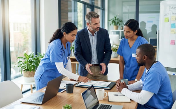 Healthcare team coordinating patient communication workflows on a tablet