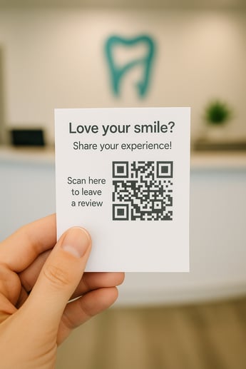 Hand holding an orthodontic appointment card with a QR code prompting patients to easily leave an online review.