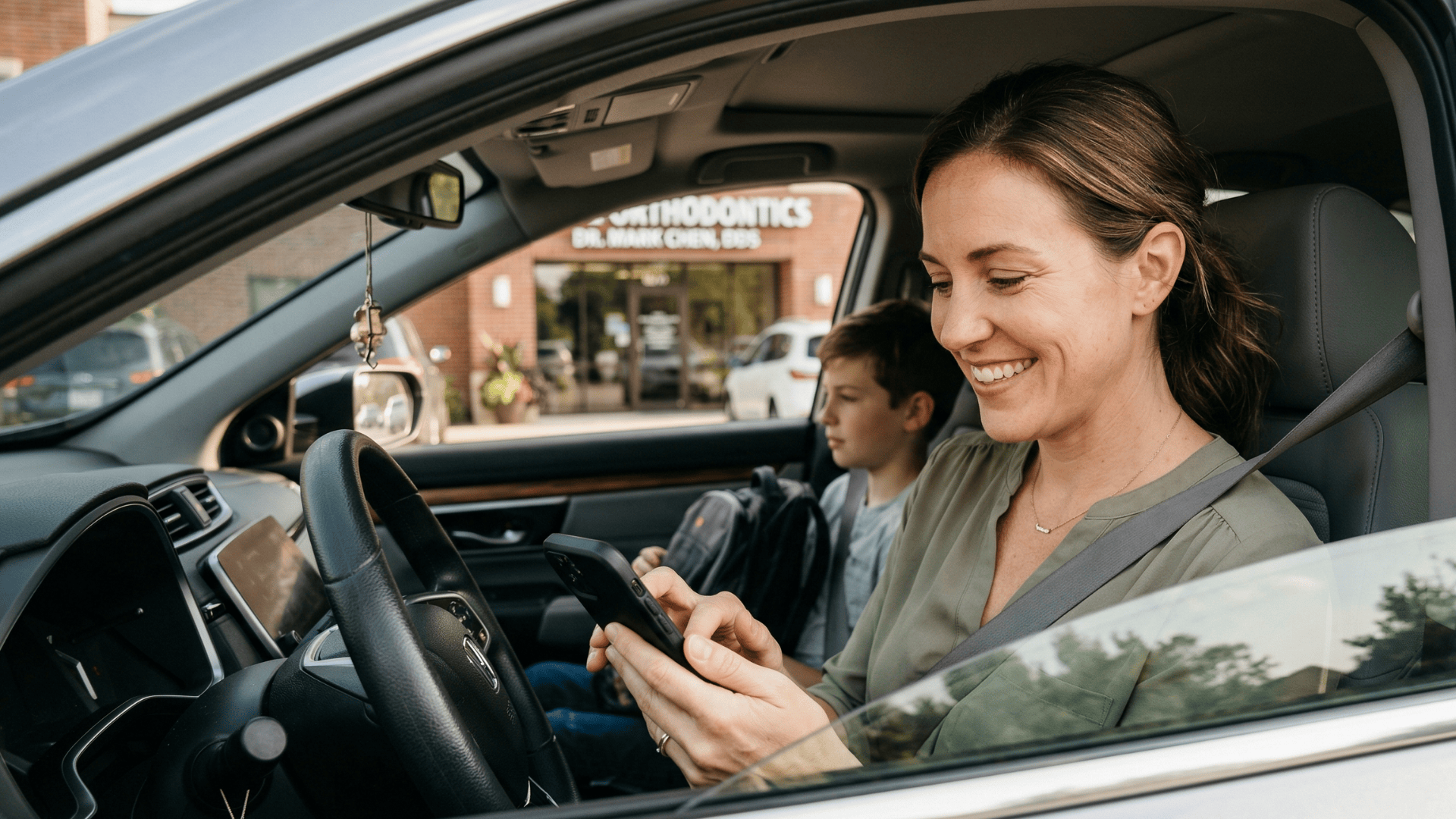 Parent leaving a Google review on phone after Cloud 9 orthodontic visit