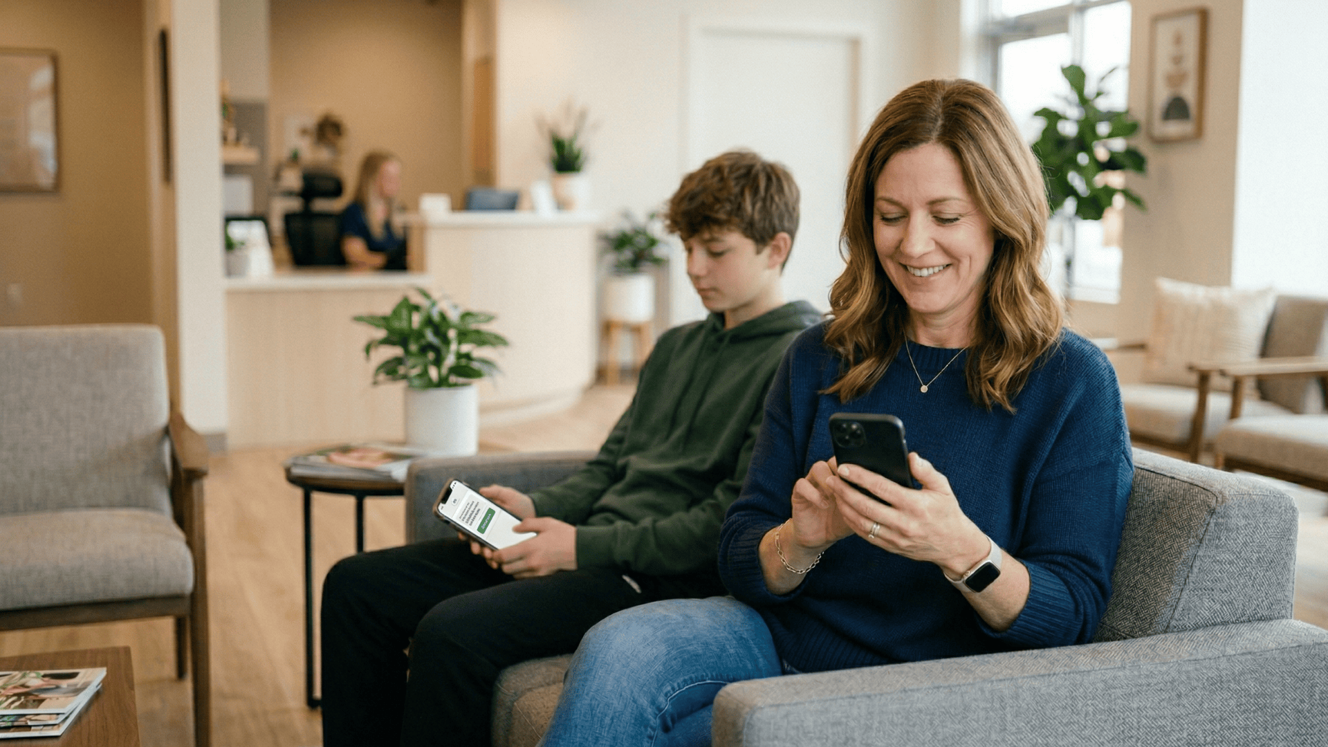 Parent booking an orthodontic appointment via text in a clinic waiting room