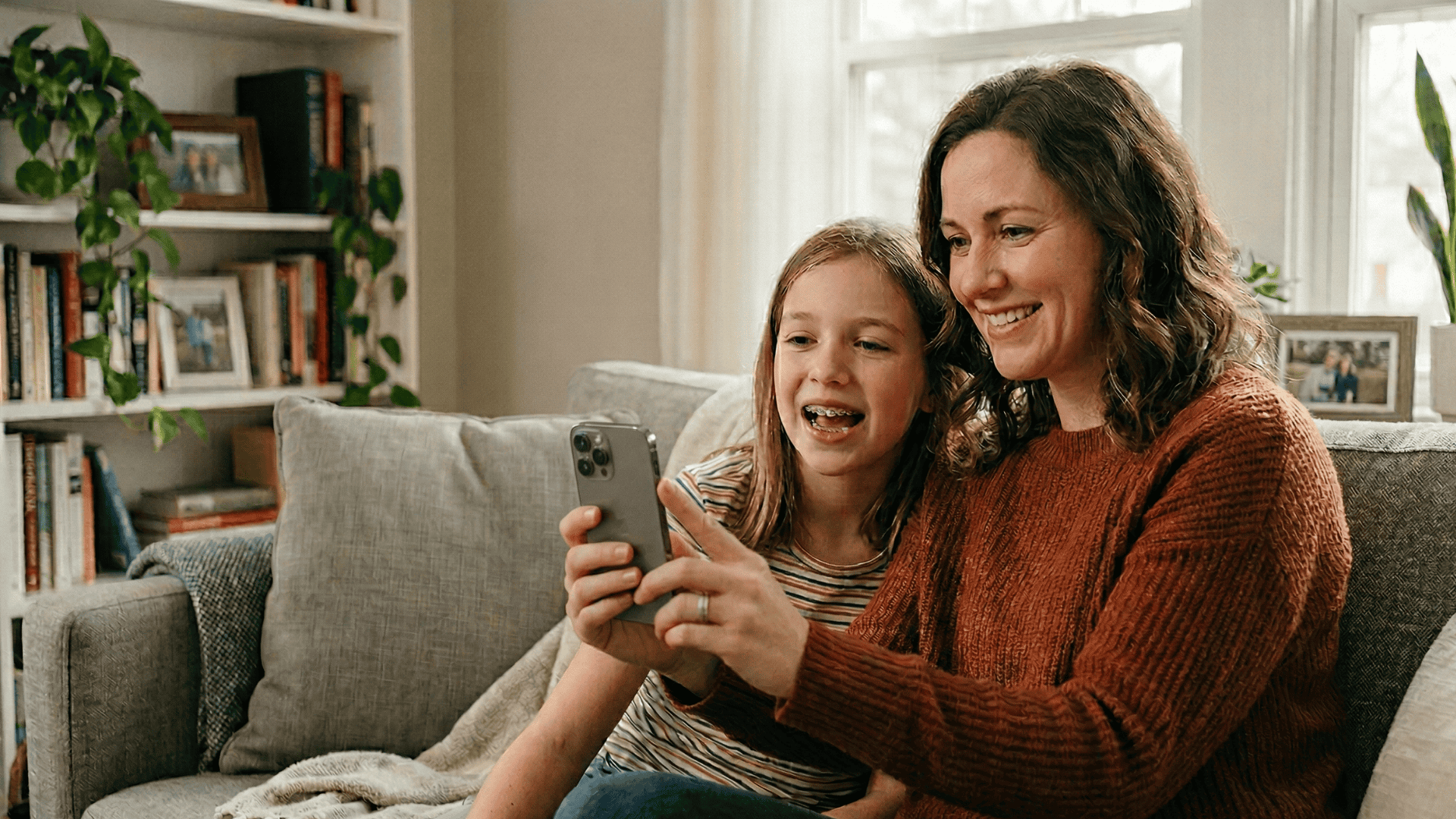 Parent and child on orthodontic telehealth video visit via text-link — no app needed