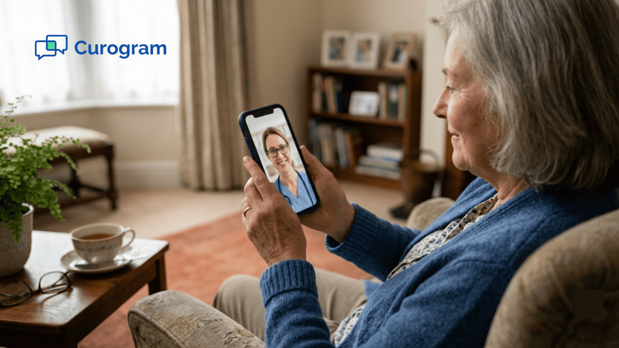 Older woman on a video visit with her doctor from her living room armchair