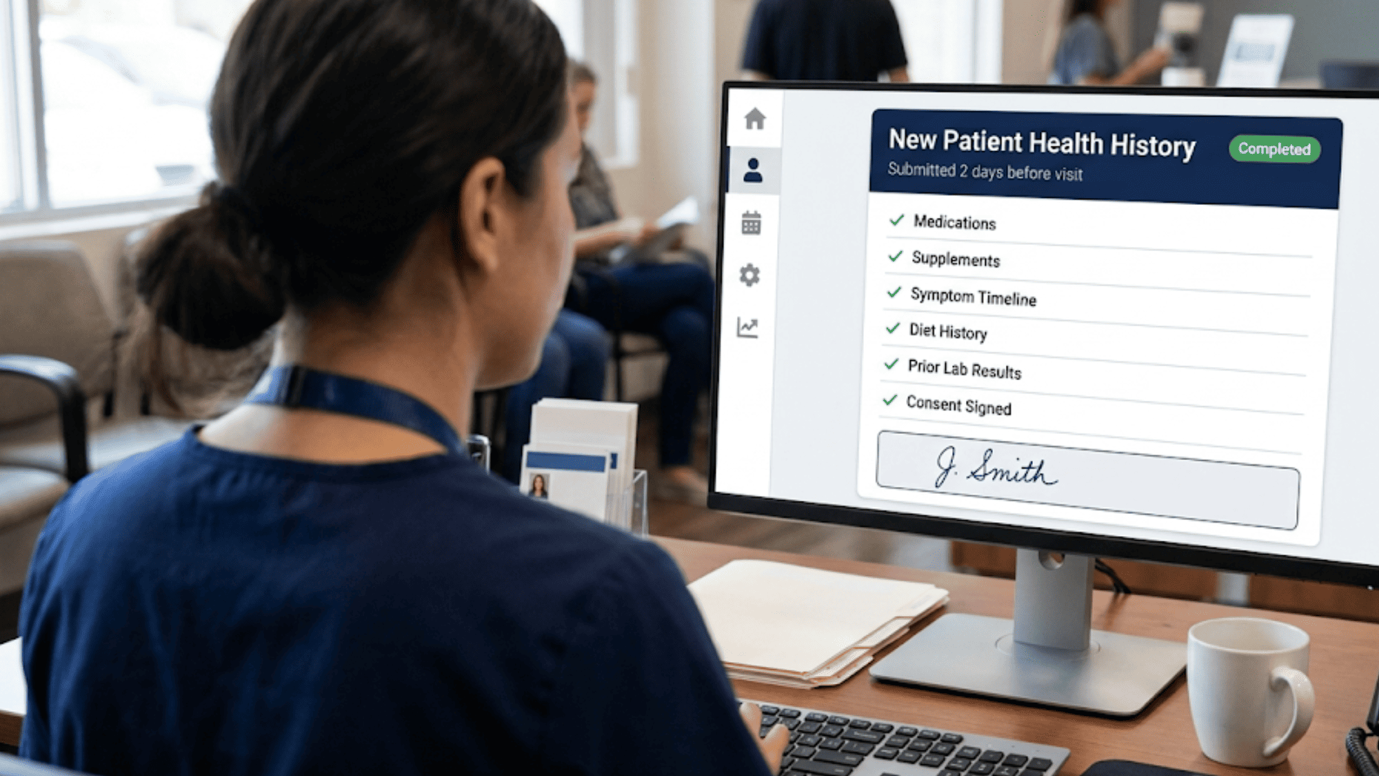 Clinic monitor showing a completed new patient health history submitted two days before the visit