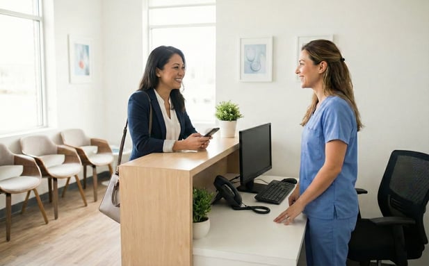 Woman using mobile check-in at clinic reception