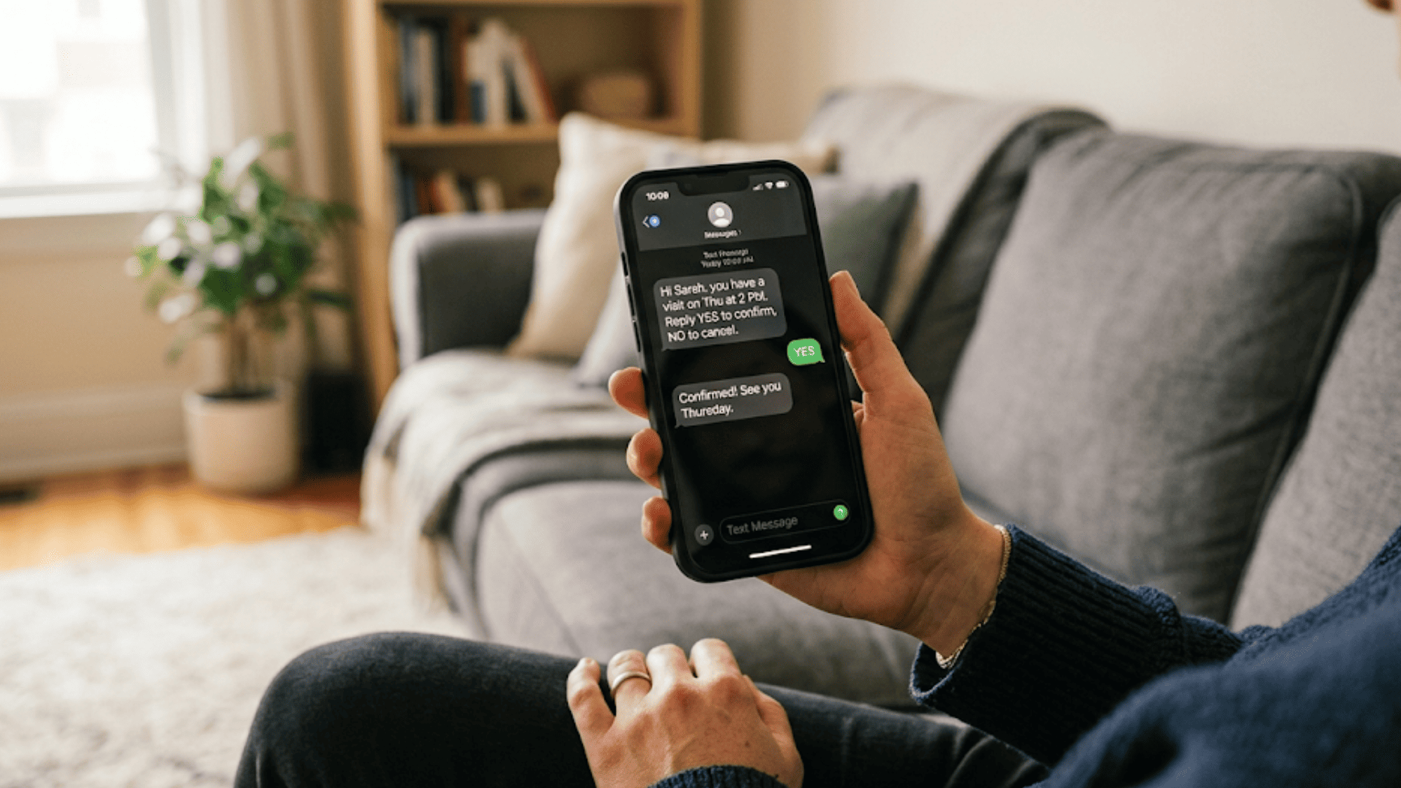 Patient confirming a medical appointment by replying YES to an SMS reminder on their phone