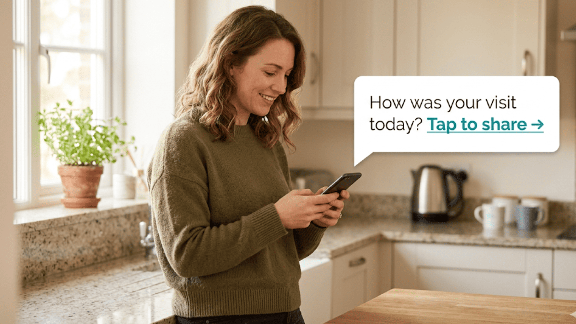 Woman in a bright kitchen reading a post-session text survey asking how her visit went with a tap-to-share review link