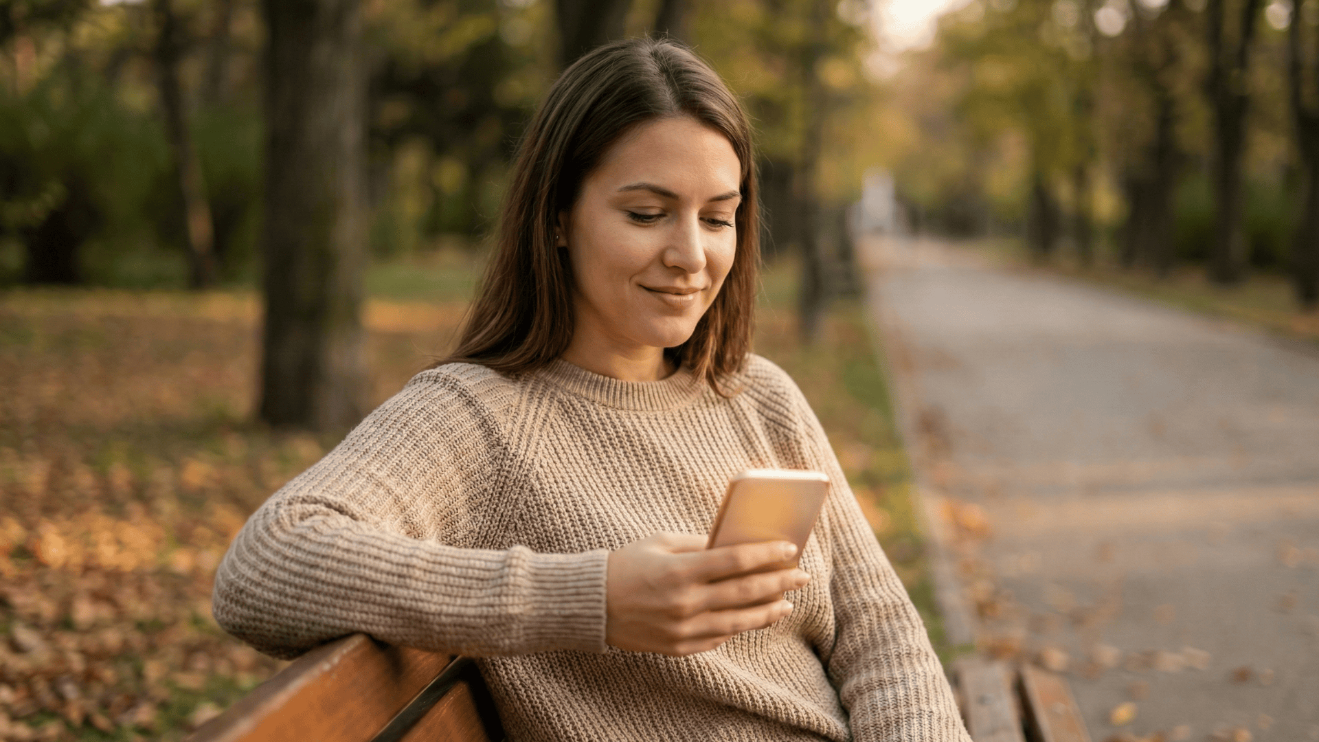 Woman reads a secure text message from her pregnancy resource center