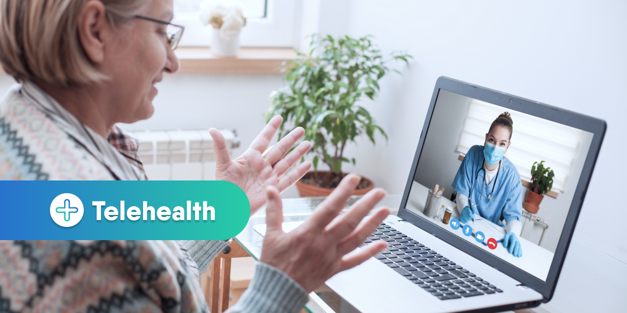 Man Sitting in Front of a Laptop on a Telehealth Call