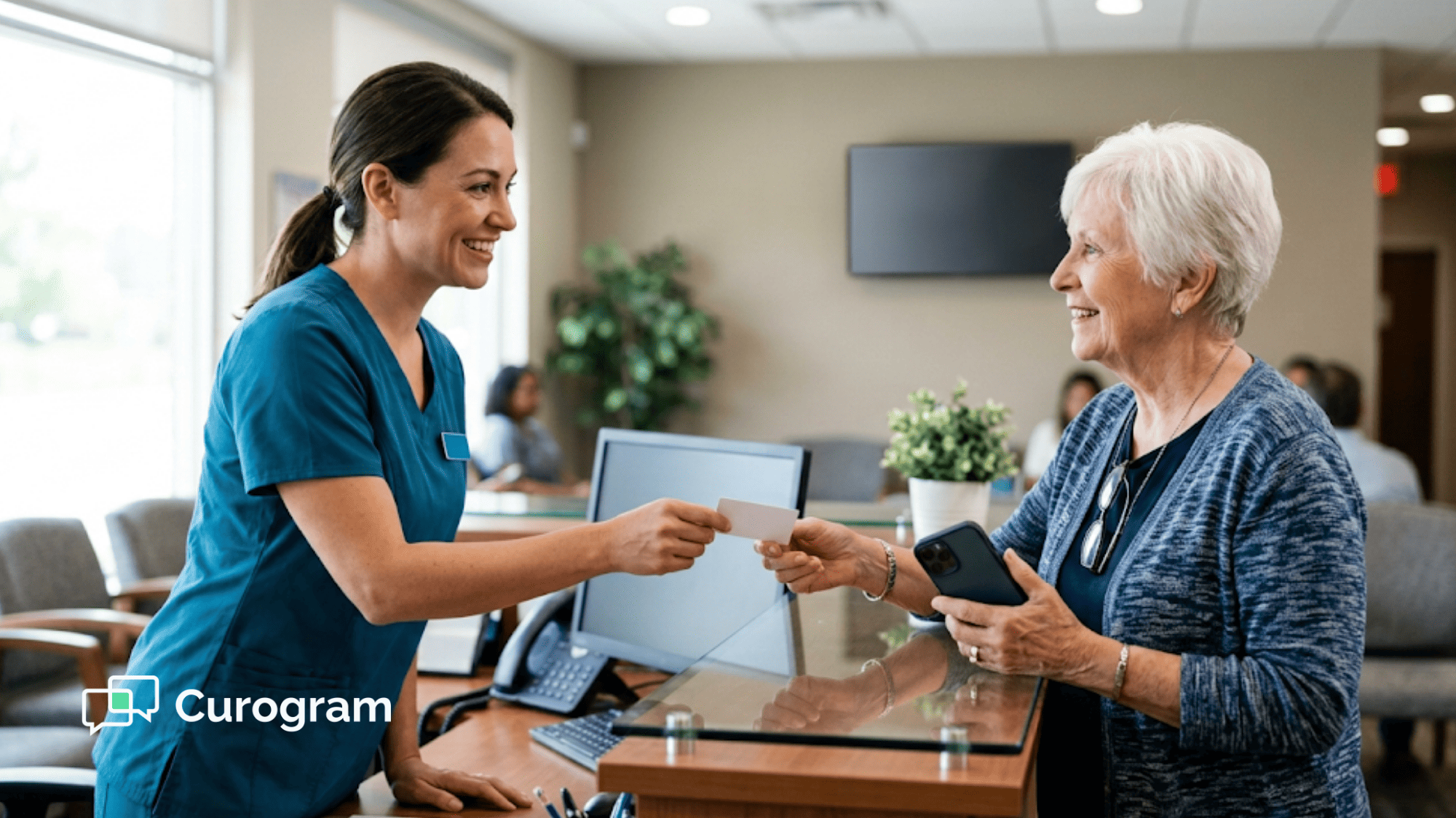Front desk staff introducing clinic texting to a patient during checkout at a medical practice