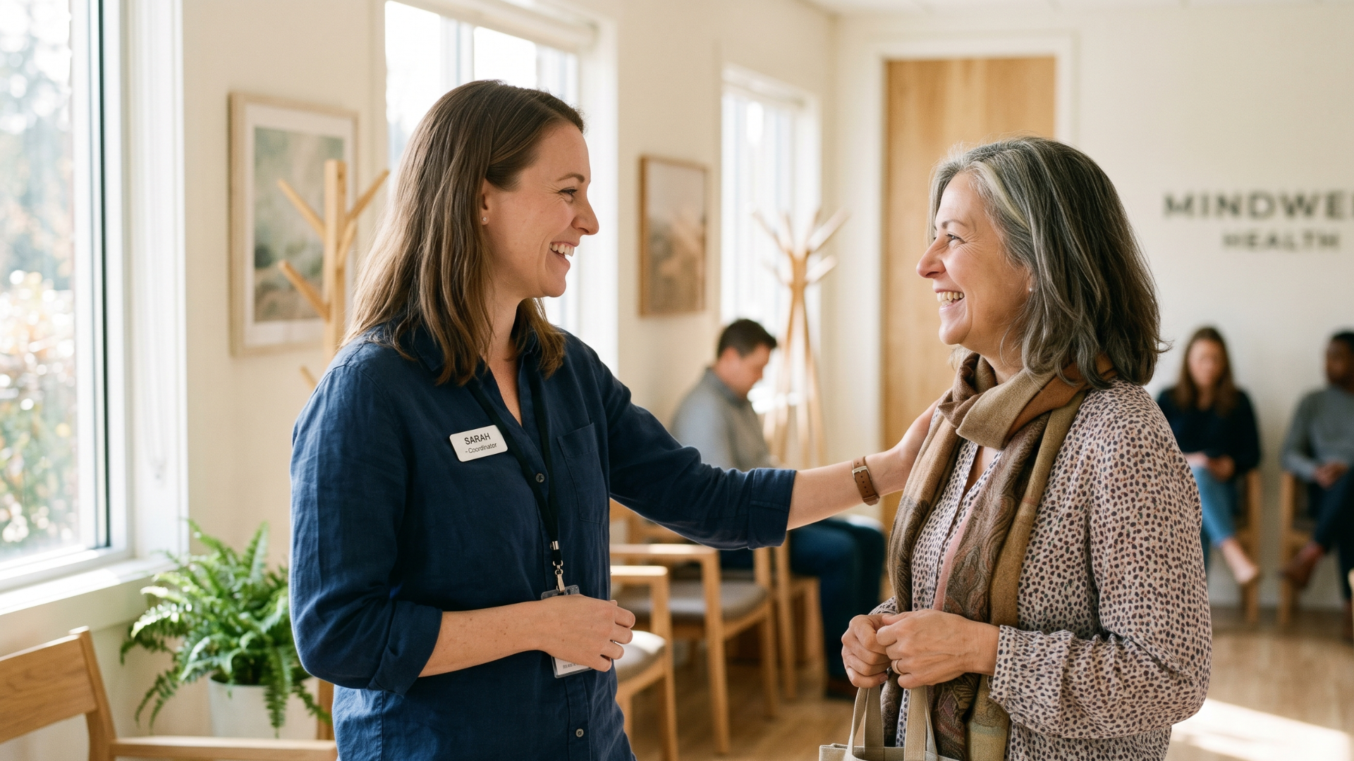 Coordinator greeting a client after adopting a group therapy mass texting workflow