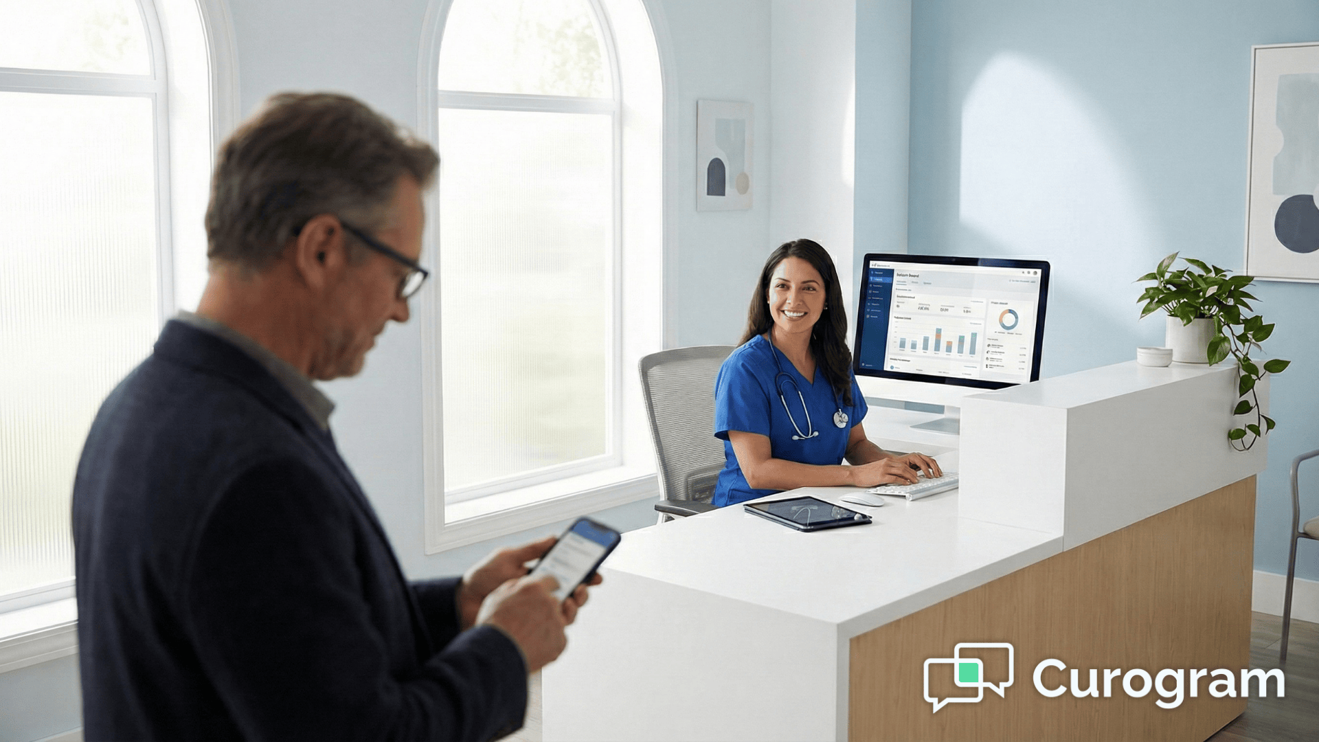 Medical receptionist at organized desk as patient checks digital forms on smartphone