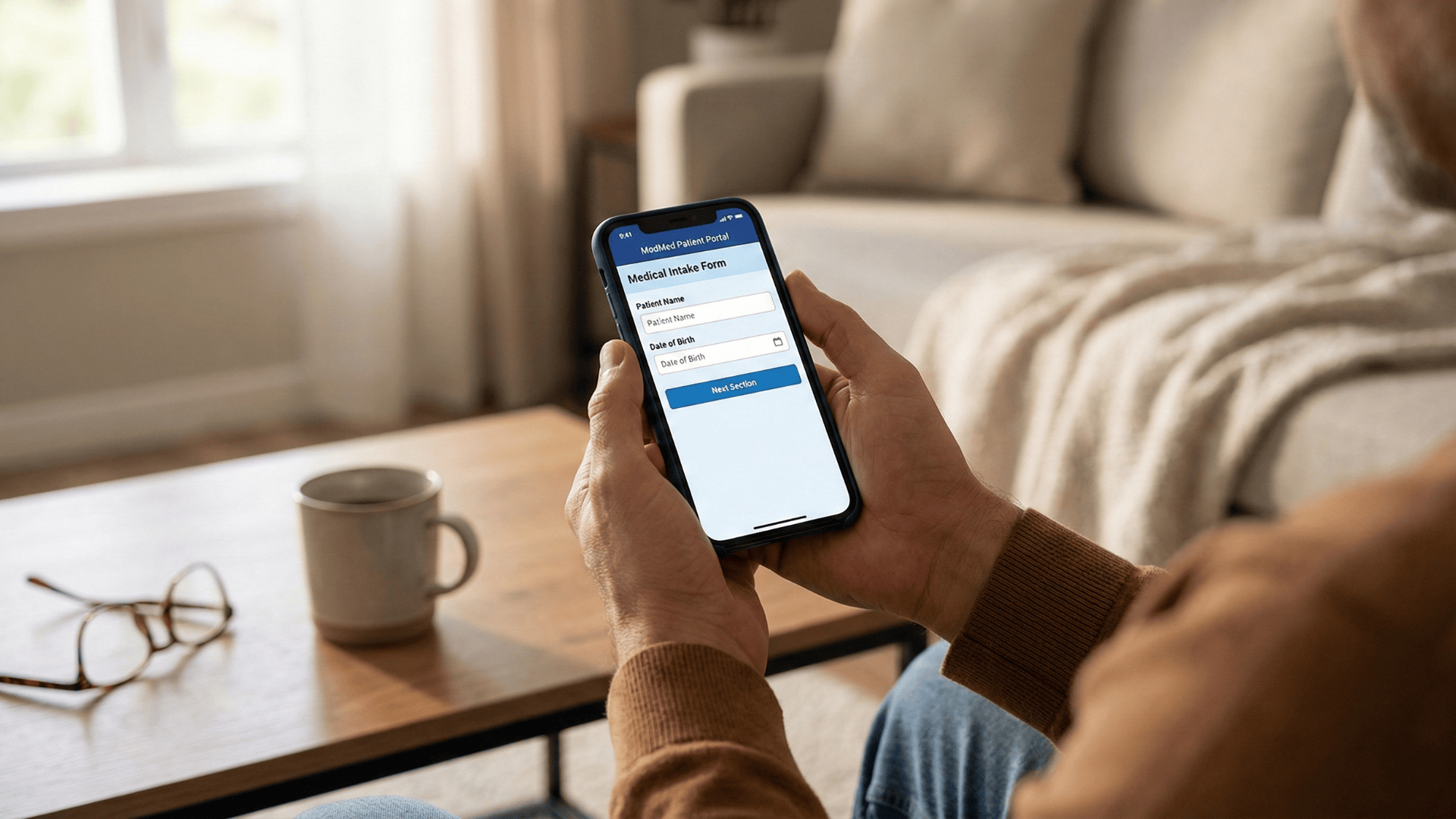 Patient completing ModMed intake forms on smartphone from home before appointment