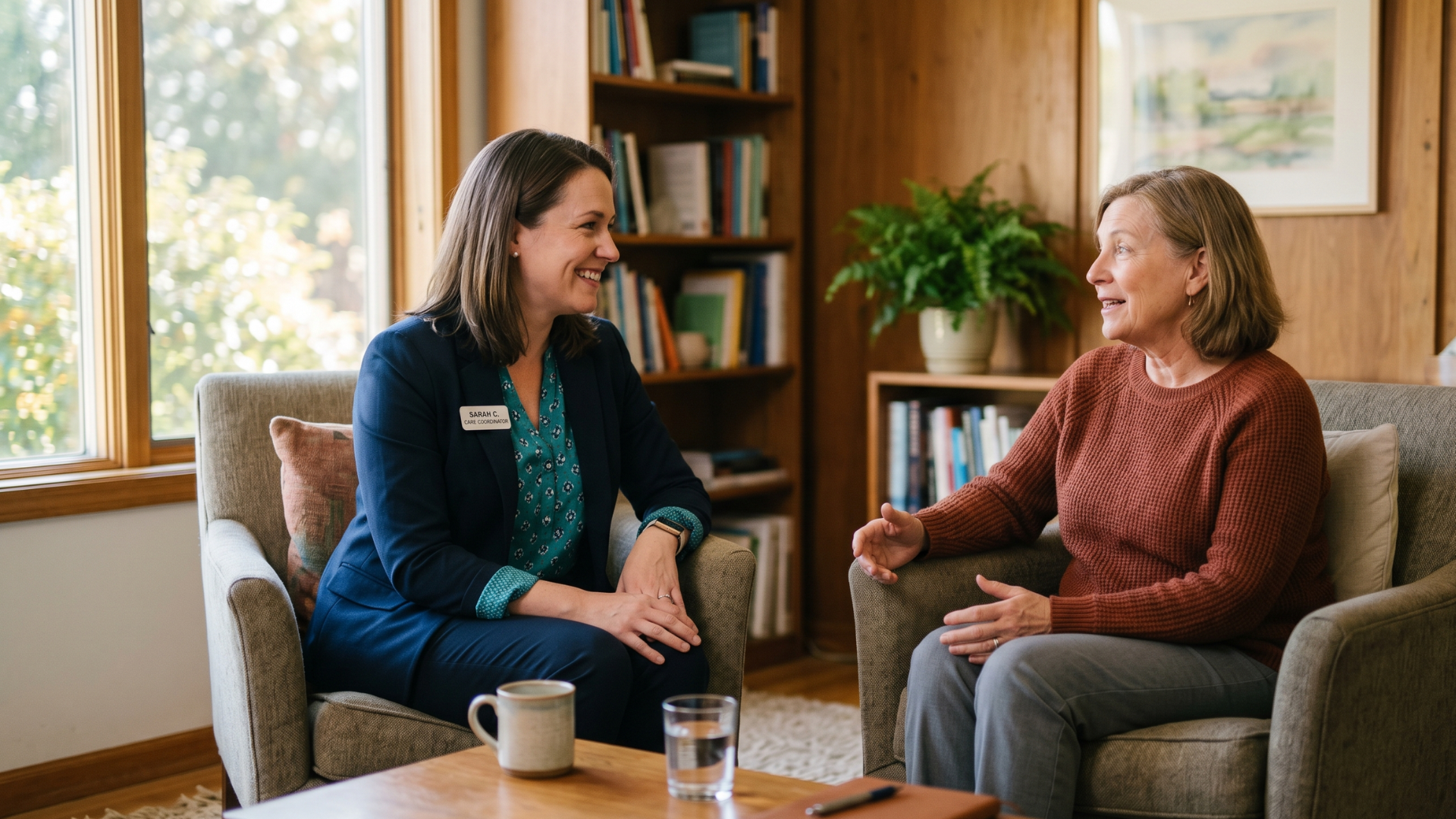 Behavioral health coordinator reassuring a client during a calm consultation