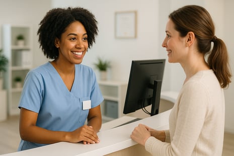 Friendly clinic receptionist warmly communicating with a patient at the front desk, illustrating effective strategies to prevent canceled appointments."