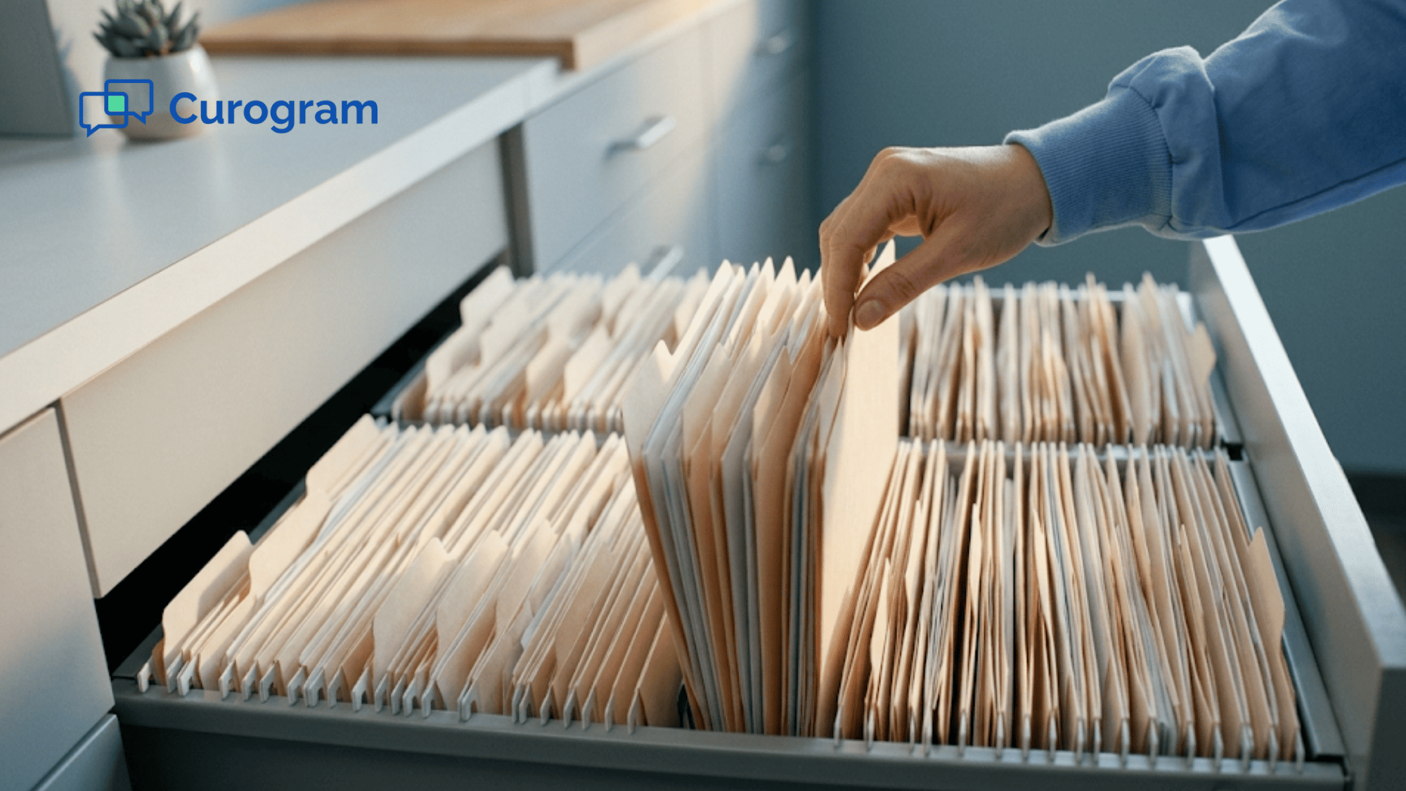 Medical records drawer with several patient folders raised in clinic sunlight