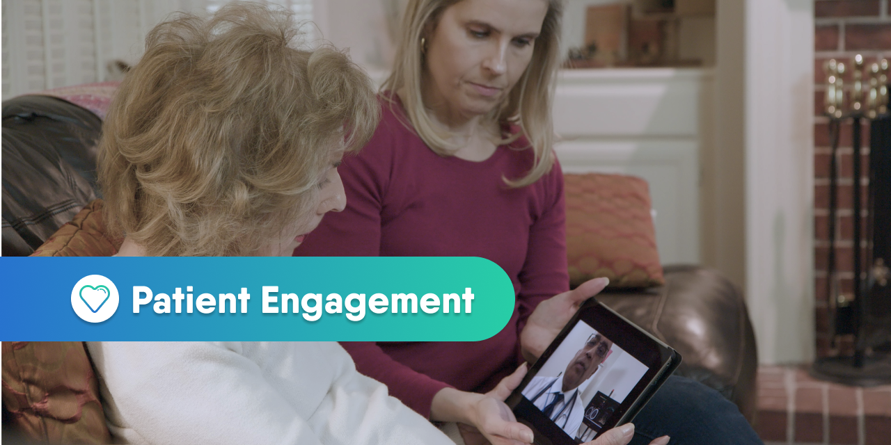 Woman and her mother looking at a tablet for a telehealth appointment