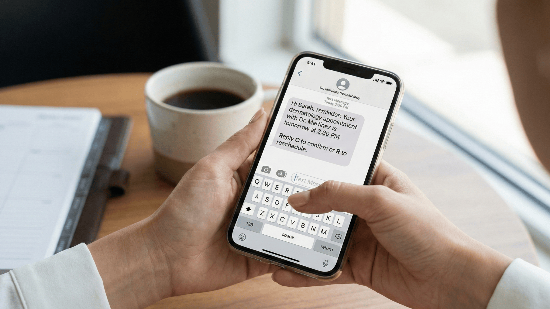 Patient smiling at recall text message in modern medical office waiting area