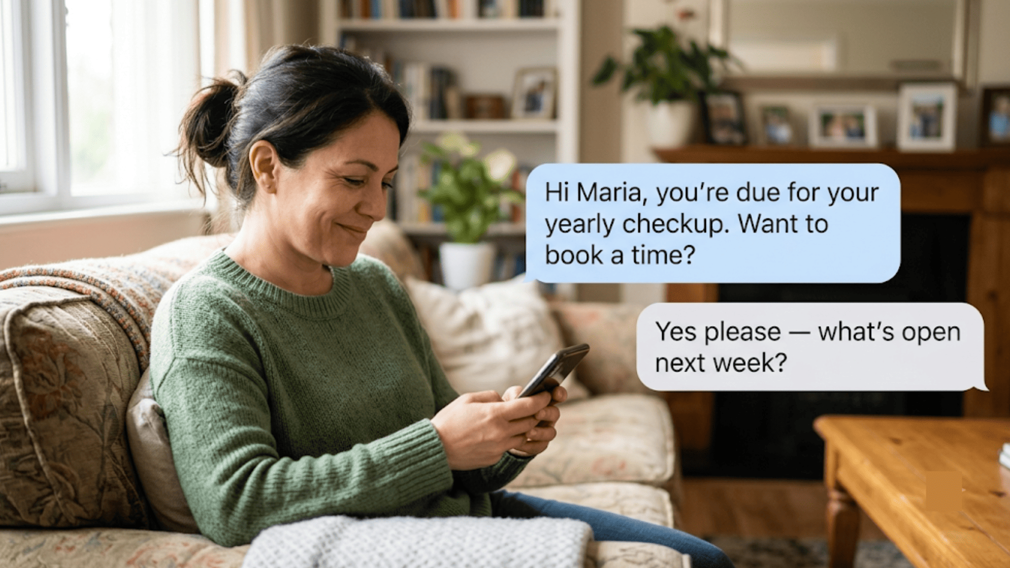 Patient at home reading a recall text inviting her to book an overdue checkup