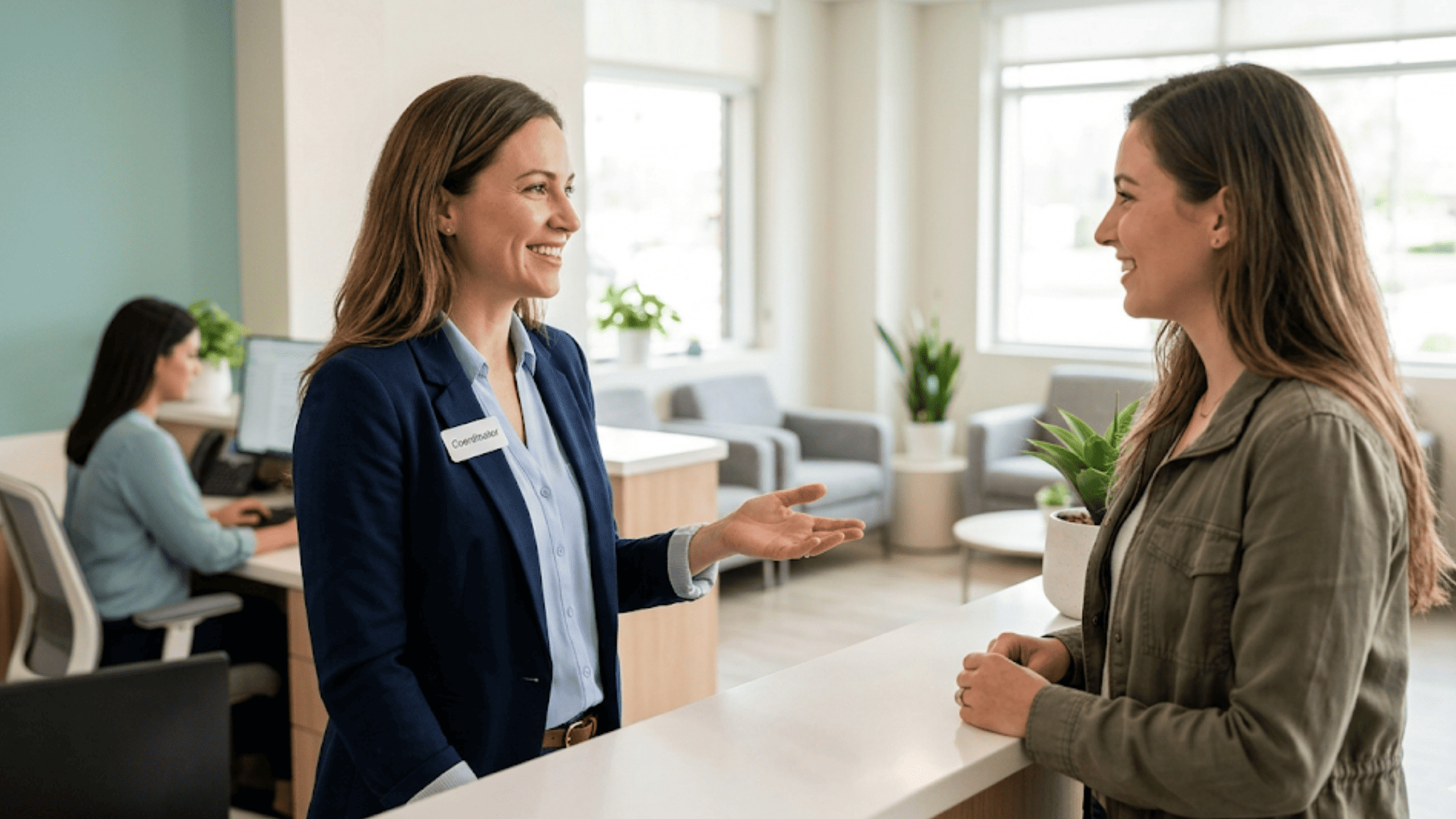 Behavioral health front-desk coordinator greeting a returning client