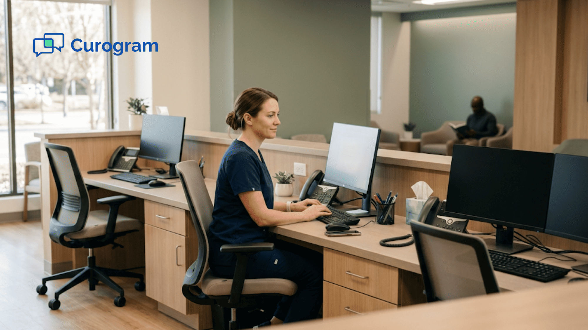 Clinic front desk with one coordinator working beside two empty reception stations
