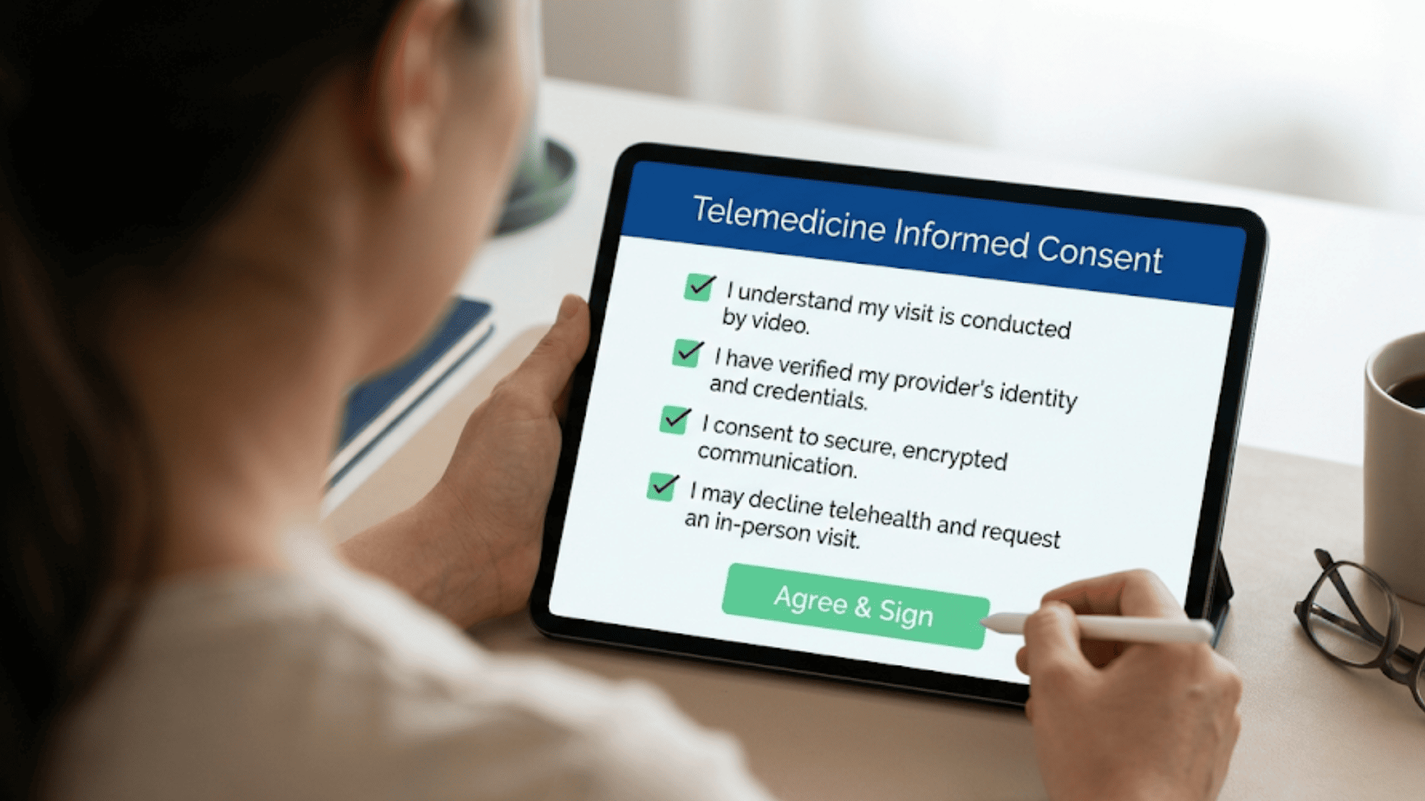 Patient signing a digital telemedicine informed consent form on a tablet before a virtual visit