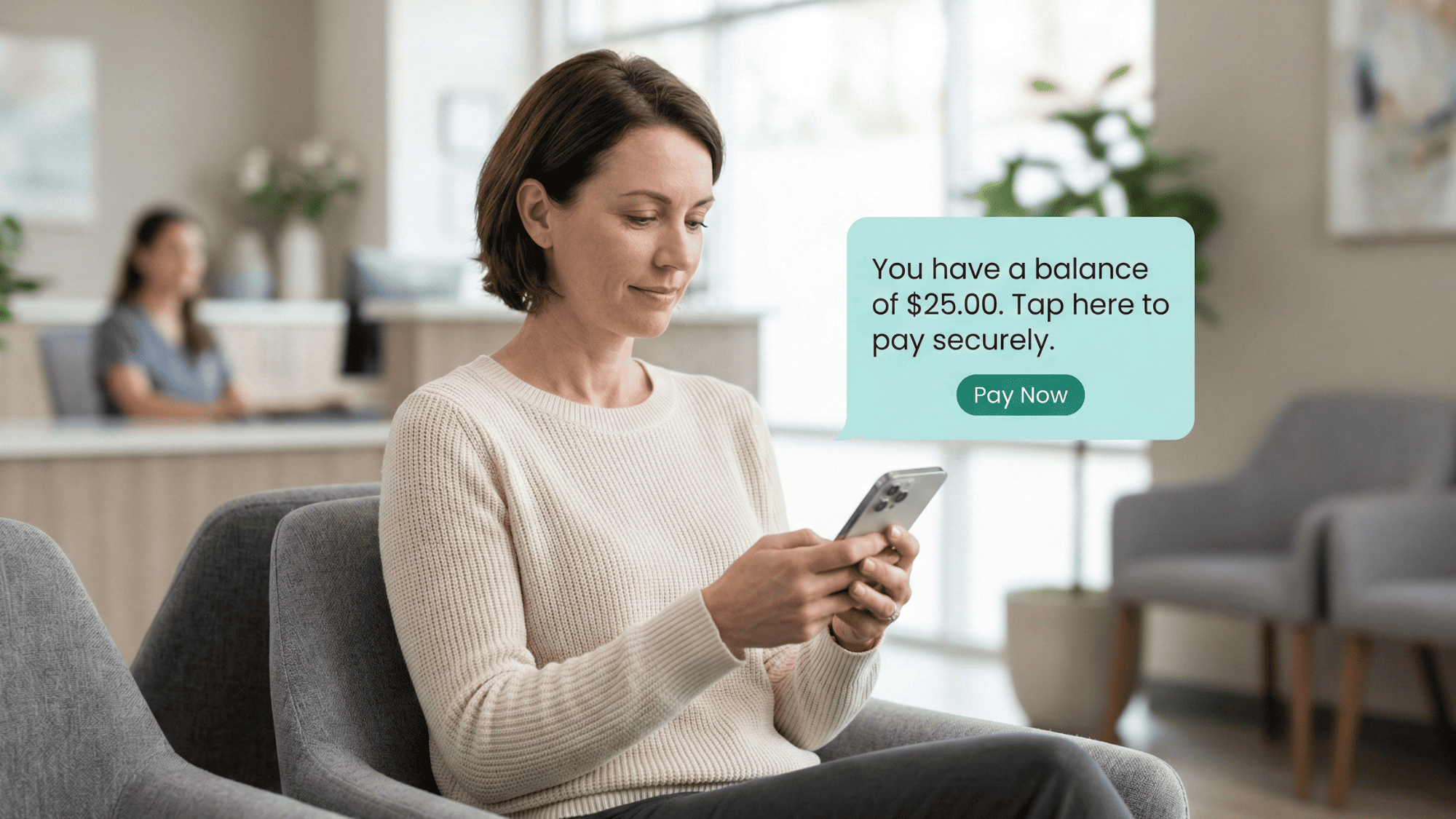 Patient in a medical office waiting room receiving a text-to-pay payment request on her phone
