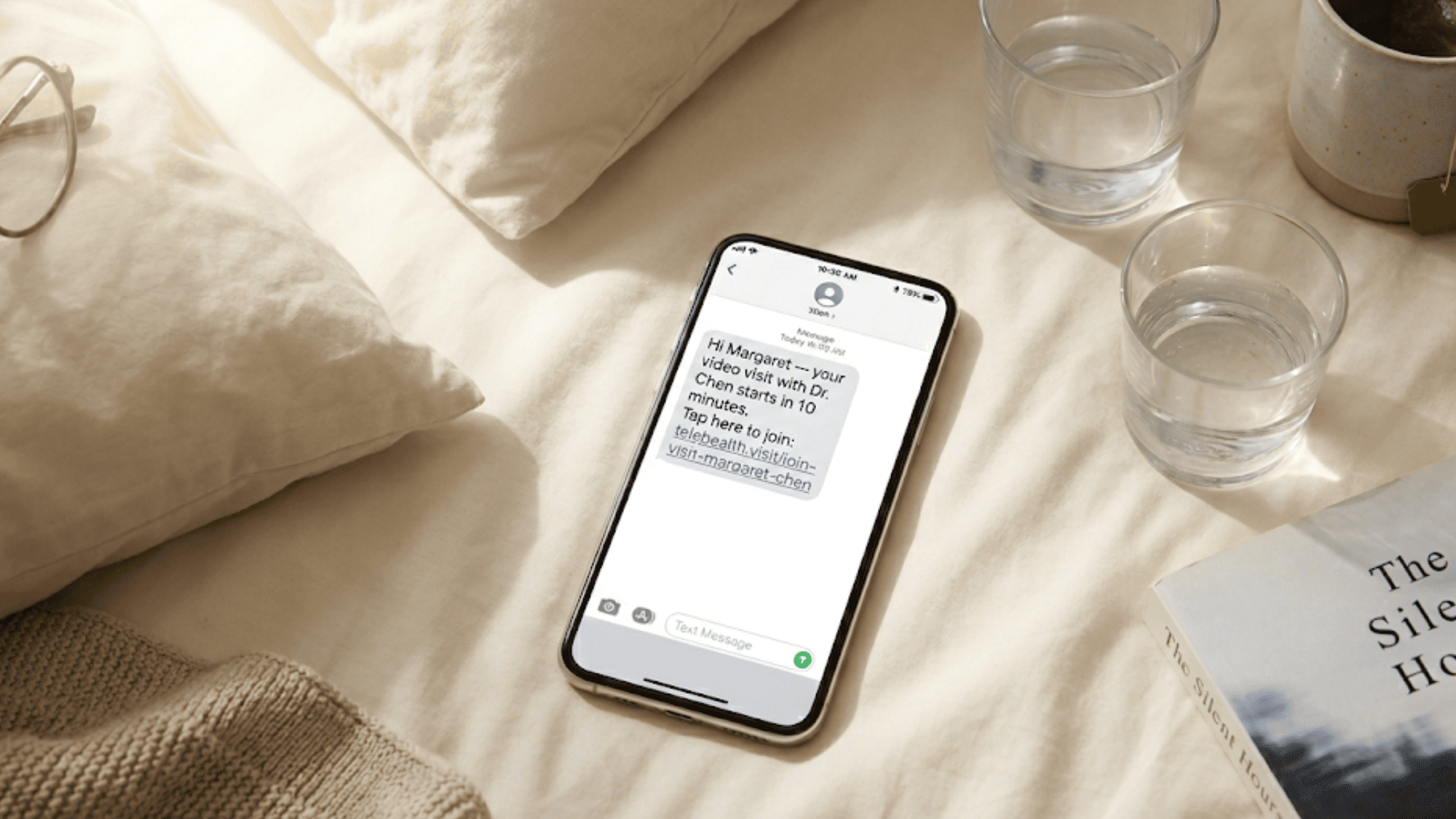 Smartphone showing oncology video visit text message with tap-to-join link from care provider