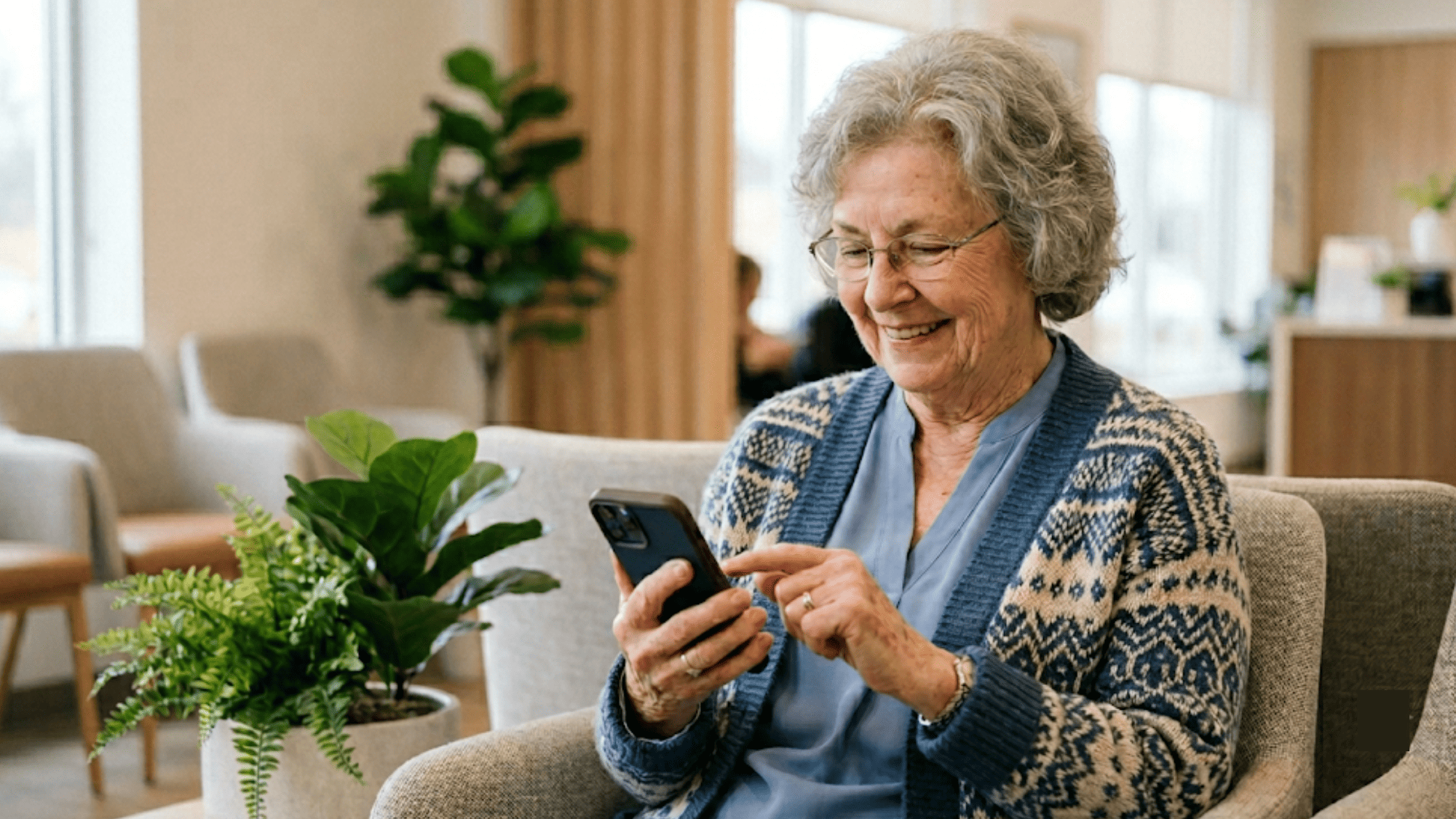 Senior patient smiling while tapping phone after an appointment