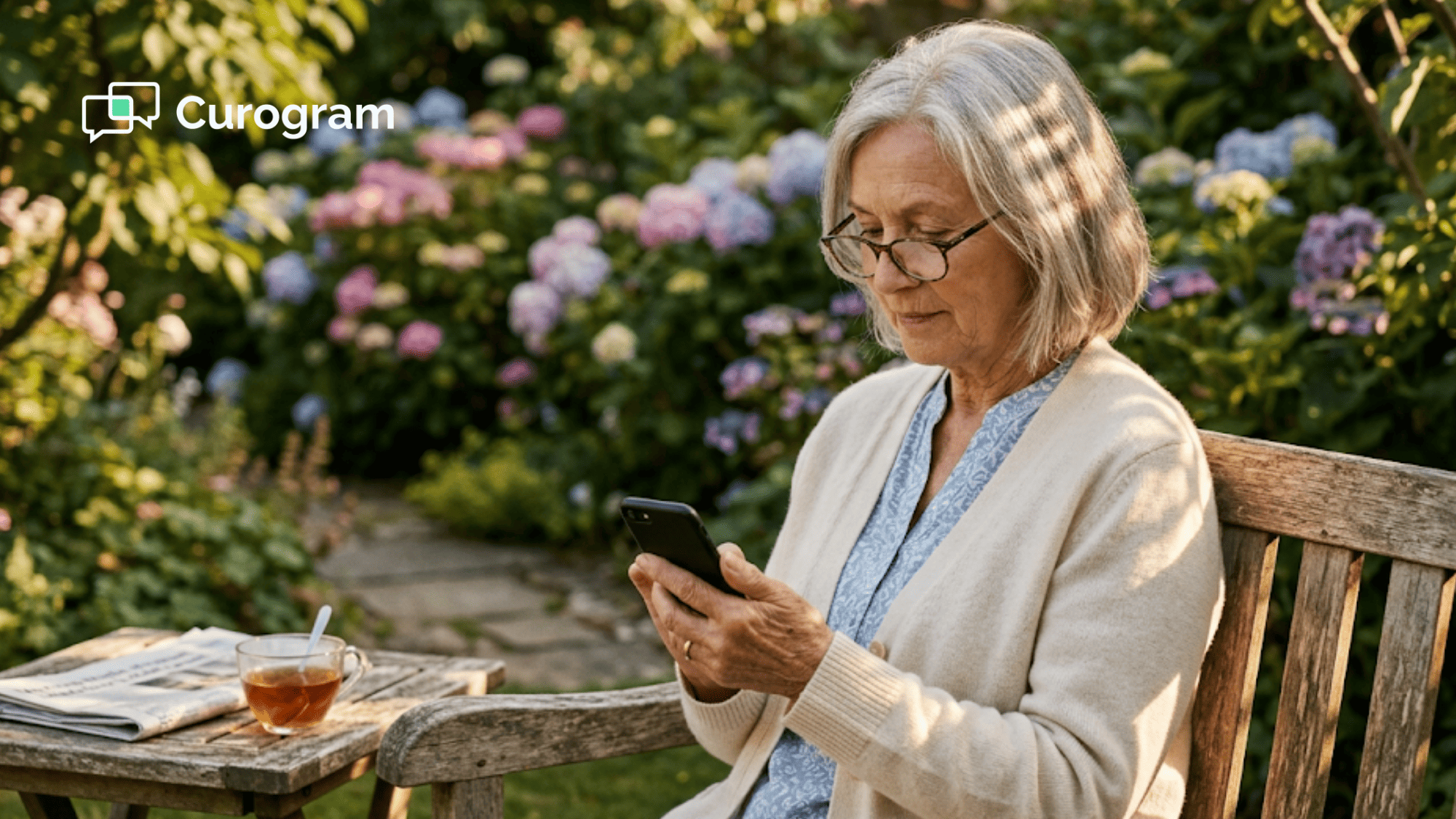 Senior patient calmly checking an SMS appointment reminder on her phone while sitting outdoors in golden hour light