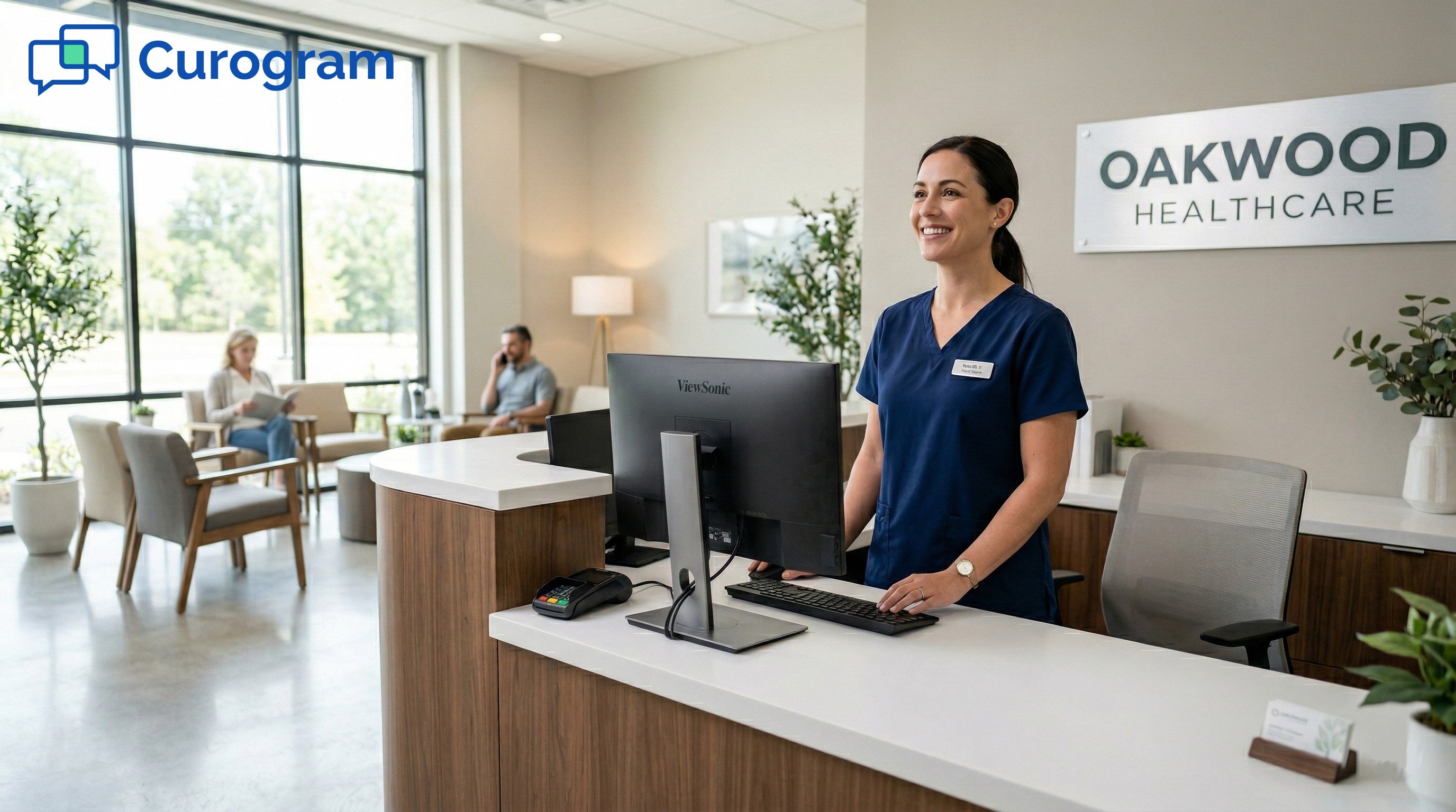 Smiling receptionist greets patients at Oakwood Healthcare front desk