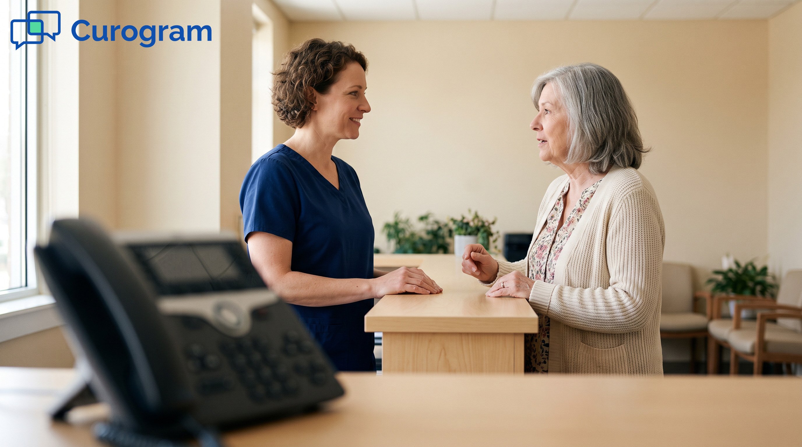 Medical receptionist talking with a patient at a clinic front desk
