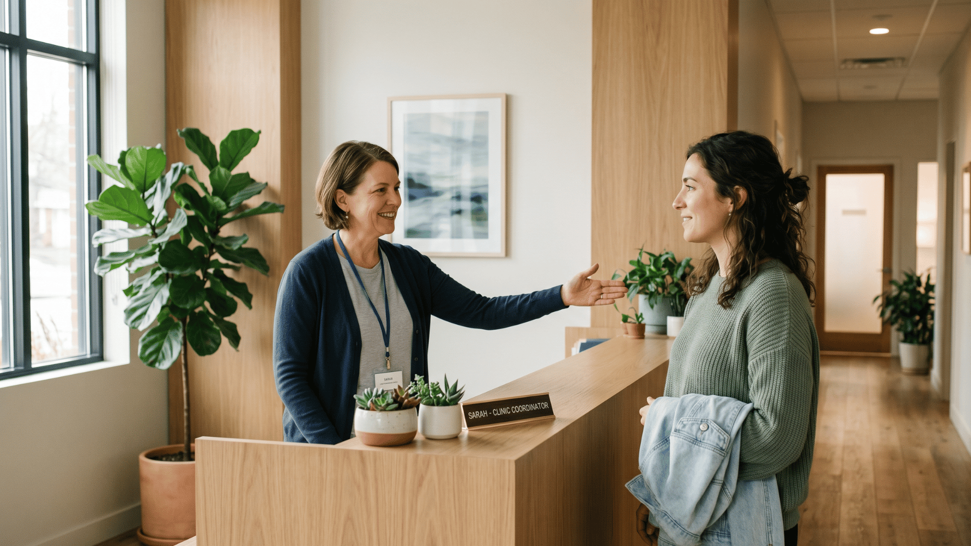 Clinic coordinator welcoming patient after confirmed automated appointment reminder in psychiatry practice