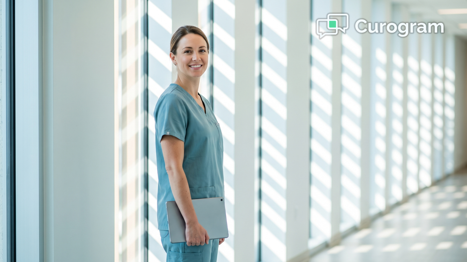 Medical assistant in a sunlit clinic corridor supporting automated patient recall outreach