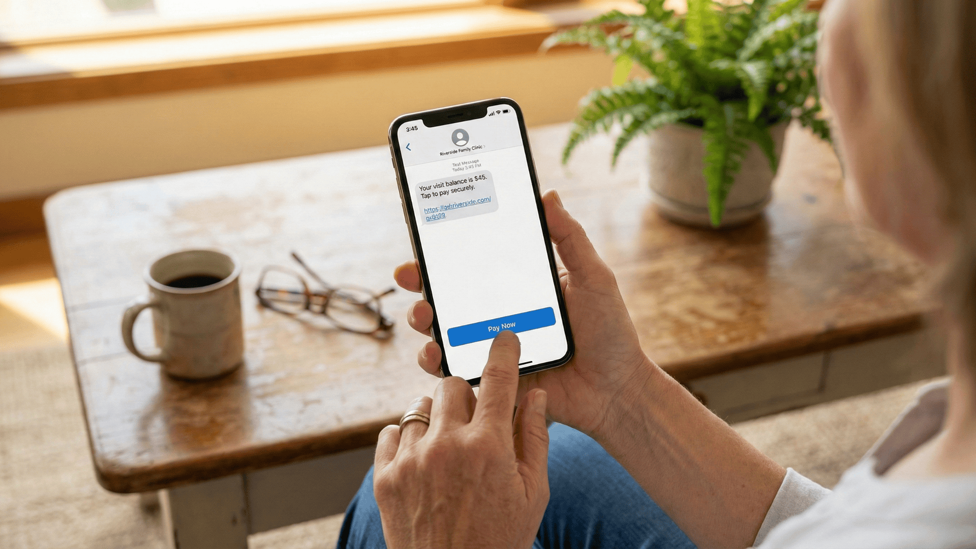 Patient paying medical bill via text-to-pay on smartphone from home