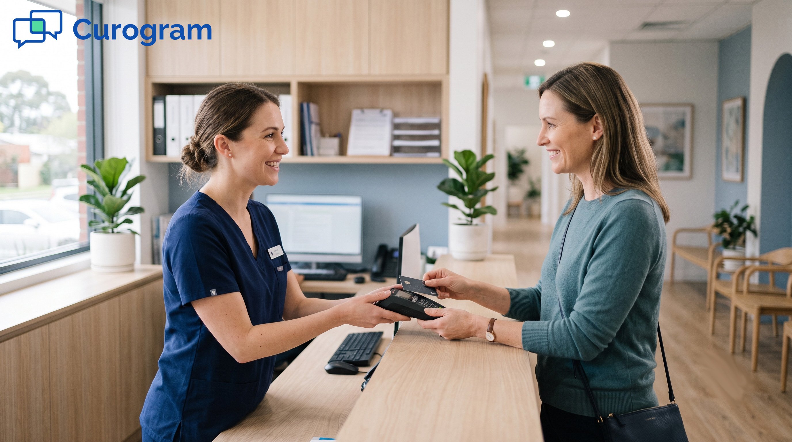 Medical receptionist and patient smiling during credit card payment