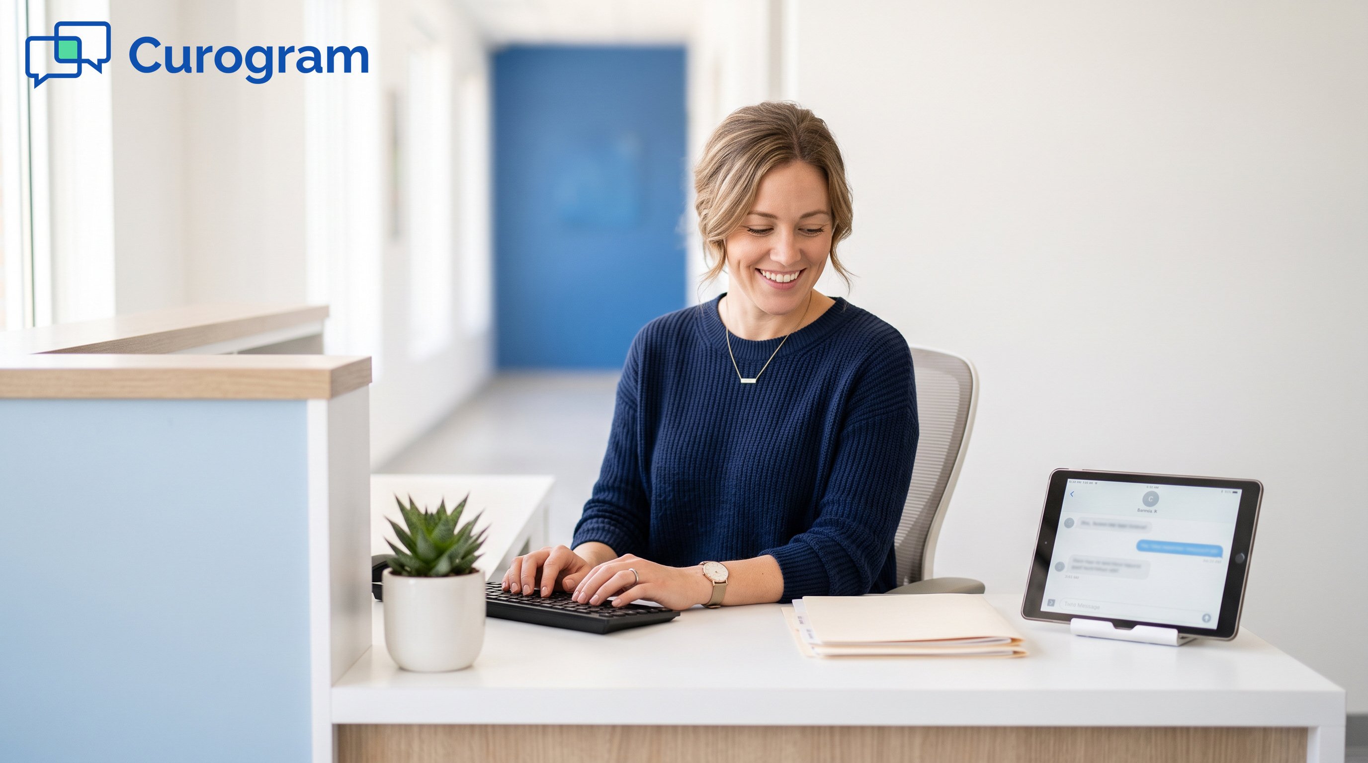 Woman on a front desk in a medical office, with a tablet beside her
