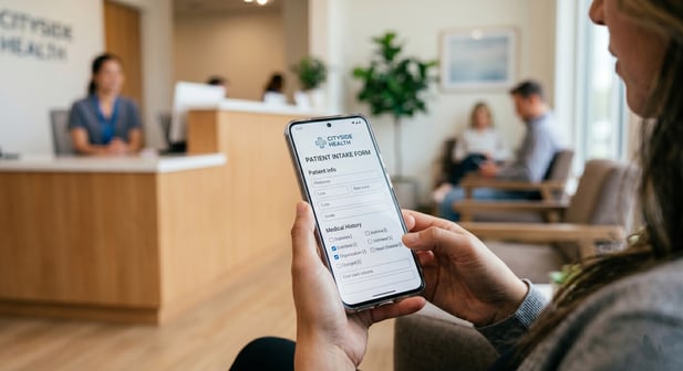 Woman filling out a digital medical intake form on her smartphone in a clinic waiting room