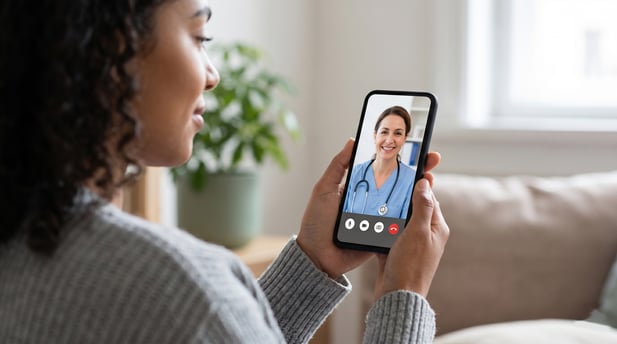 Woman at home on a virtual consultation with a doctor