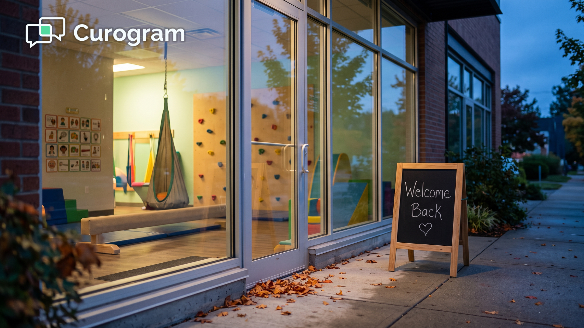 Pediatric therapy clinic at dusk with a Welcome Back sign inviting paused families to return