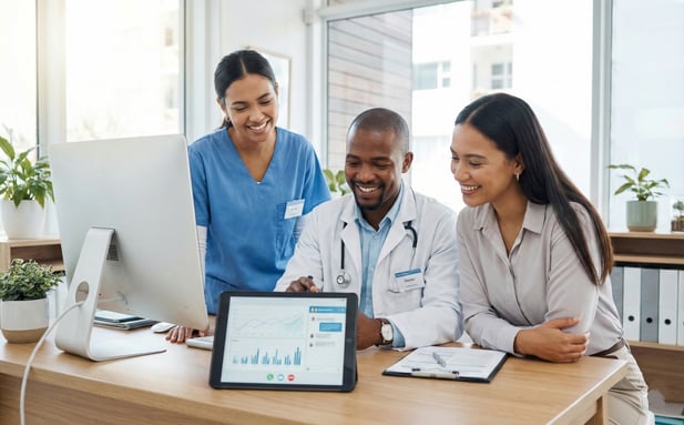 Medical staff collaborating on patient communication efficiency using a digital tablet