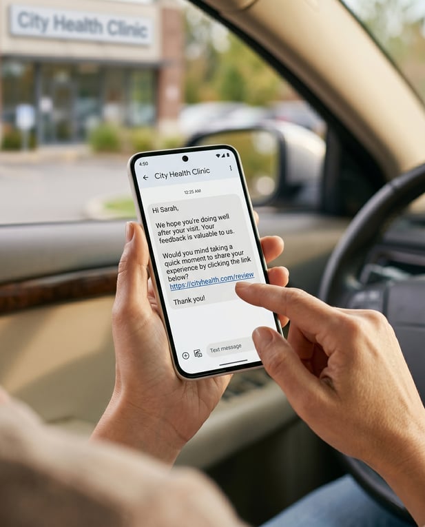 Close up of patient reading clinic review request SMS on smartphone