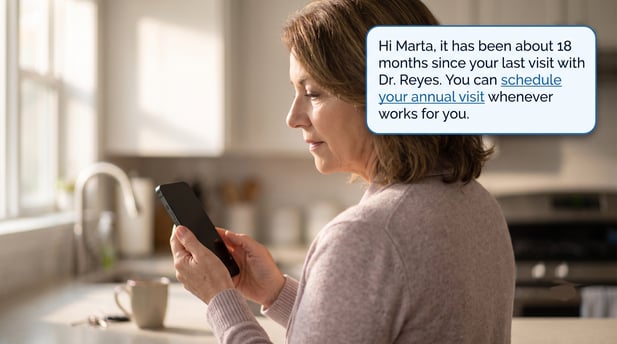Marta viewing a text message reminder for an annual clinic visit