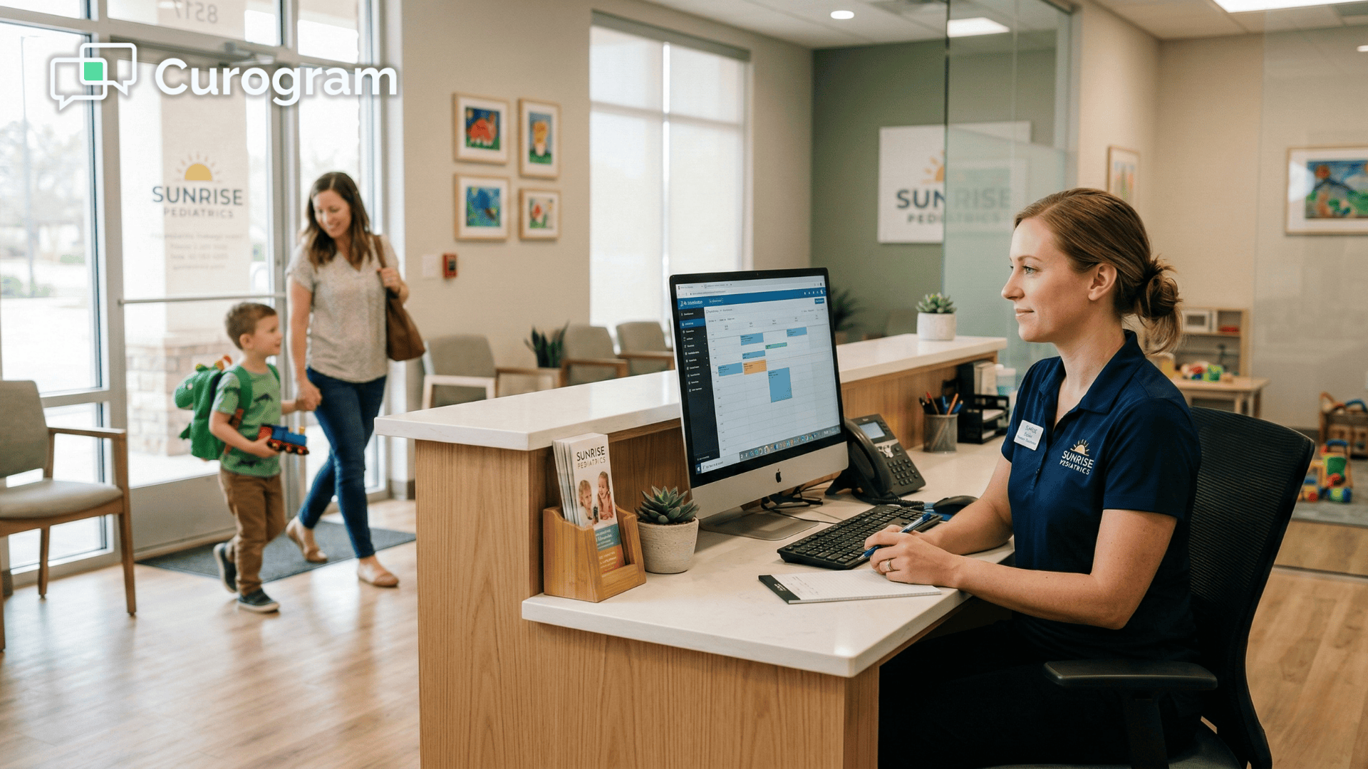 Front desk staff welcoming a parent and child arriving for pediatric therapy